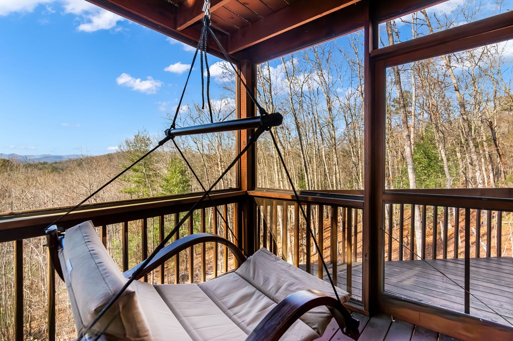 249 Sugar Mountain Road Blue Ridge, GA 30513 - Photo 35 of 61 a view of a balcony with furniture