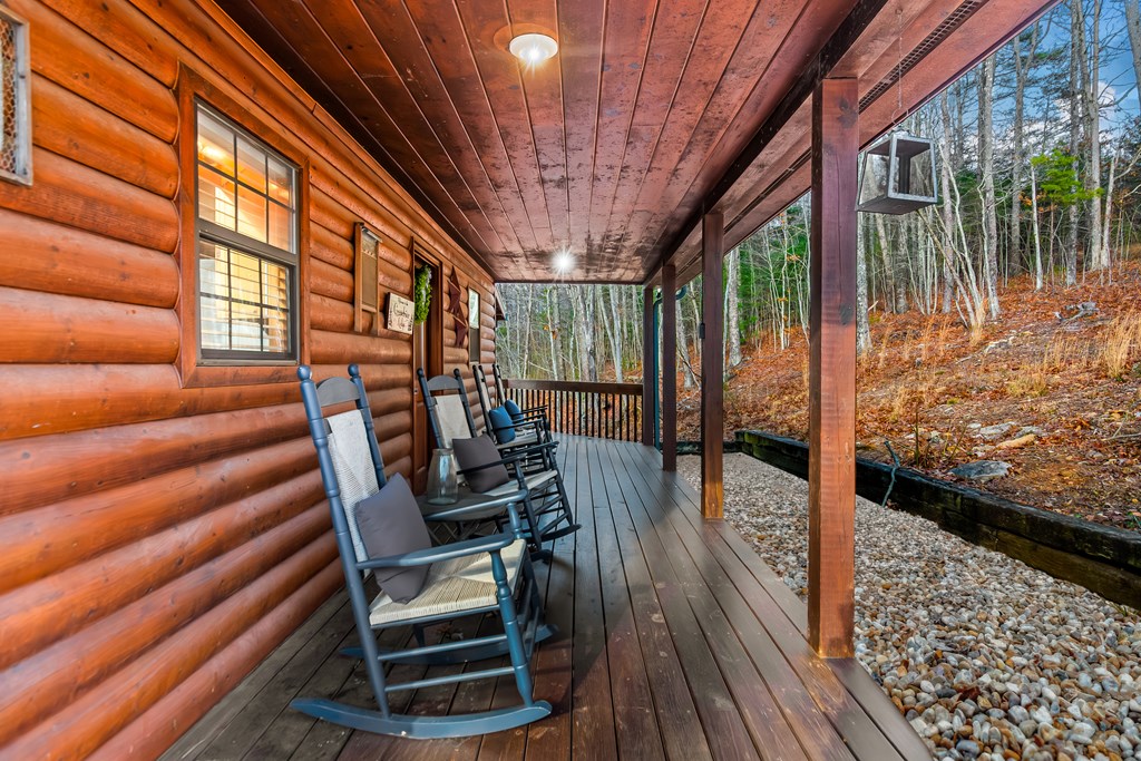 249 Sugar Mountain Road Blue Ridge, GA 30513 - Photo 49 of 61 a view of balcony with wooden floor and outdoor seating