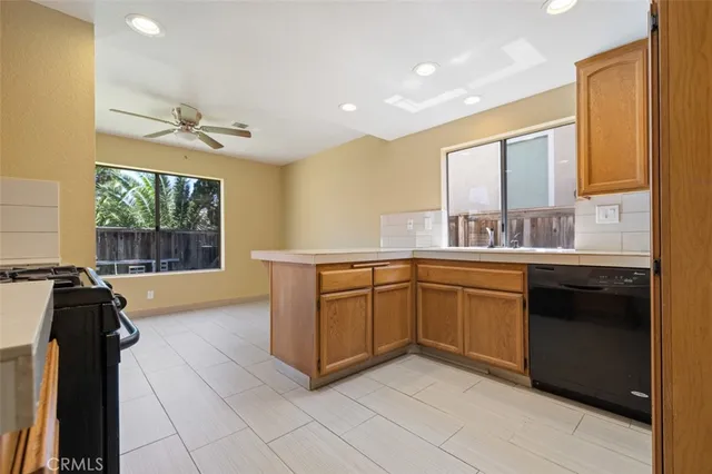 a kitchen with a sink and a stove top oven