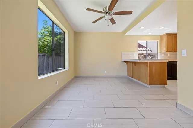 a view of a kitchen with a sink and a window
