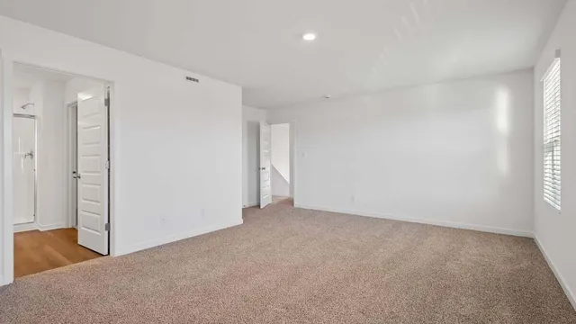 a bathroom with a shower sink and mirror