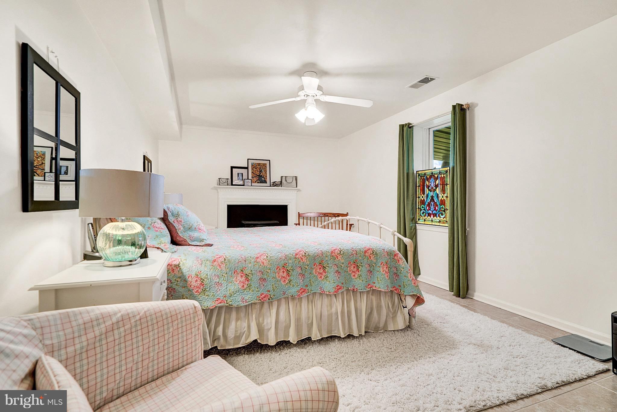 9692 Ridge View Drive Marshall, VA 20115 - Photo 14 of 26 a bedroom with a bed and a chandelier