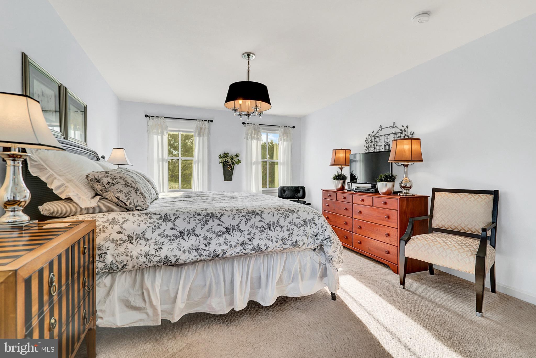 9692 Ridge View Drive Marshall, VA 20115 - Photo 10 of 26 a bedroom with a bed mirror and window