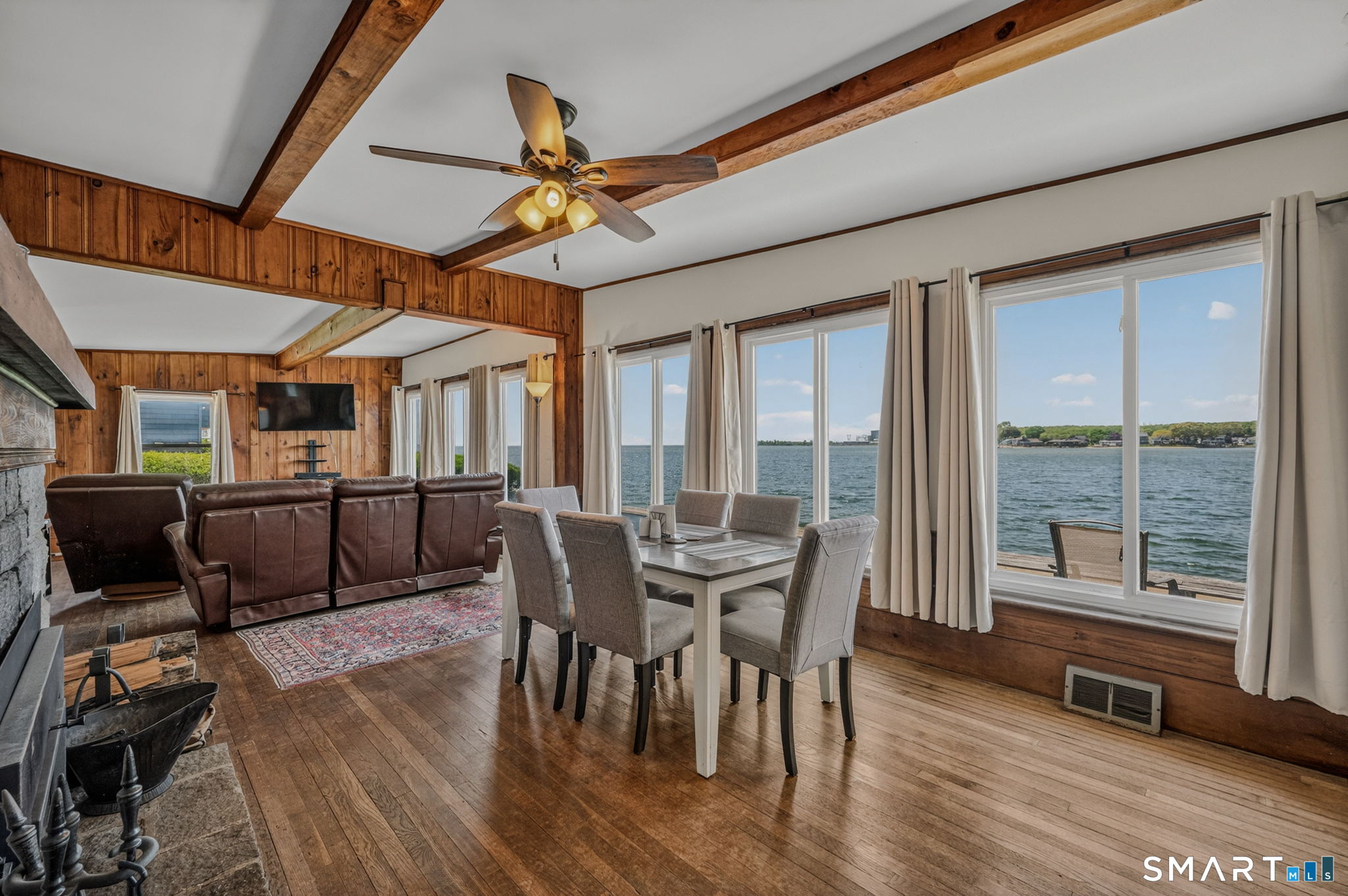 210 Shore Road Waterford, CT 06385 - Photo 19 of 26 a view of a dining room with furniture window and wooden floor