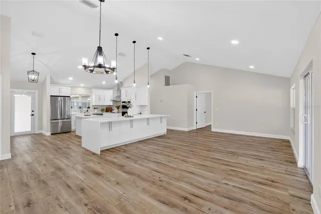 a bathroom with a granite countertop sink a toilet and shower