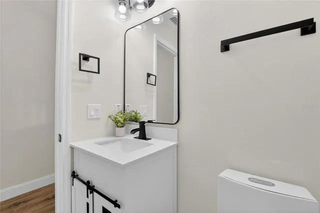 a view of an empty room with a floor to ceiling window and stairs