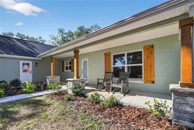 a kitchen with stainless steel appliances a refrigerator sink and microwave