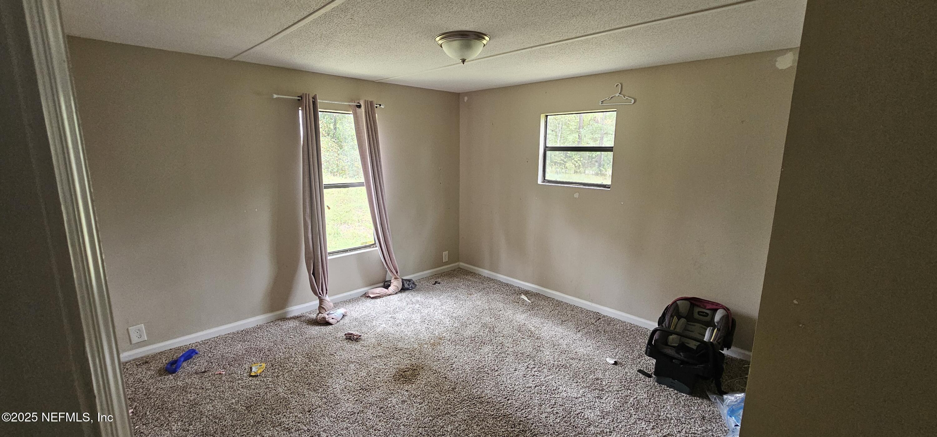 5951 Westwood Road North Jacksonville, FL 32234 - Photo 12 of 33 a room that has a bed and a window