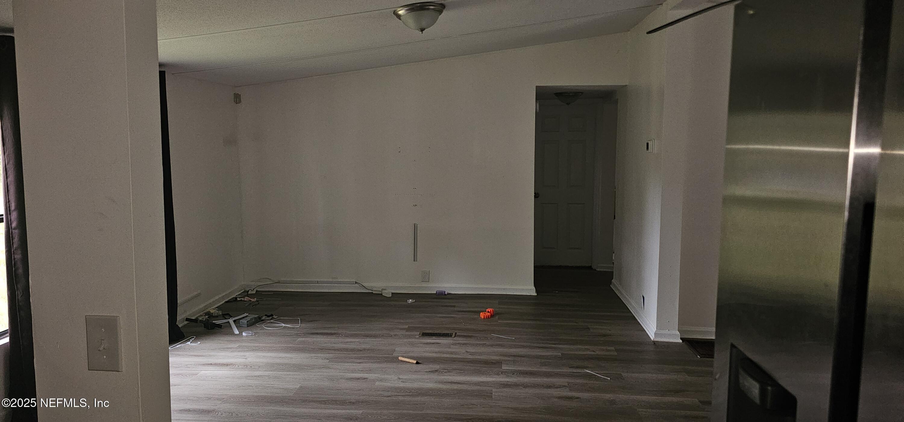 5951 Westwood Road North Jacksonville, FL 32234 - Photo 13 of 33 a view of room with wooden floor