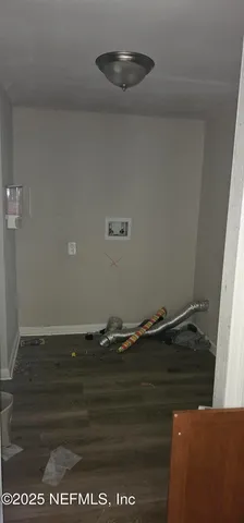 an empty room with wooden floor