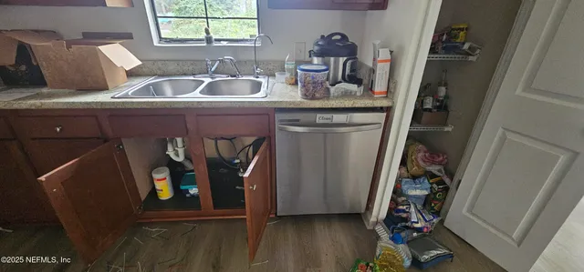 a bathroom with a sink and mirror