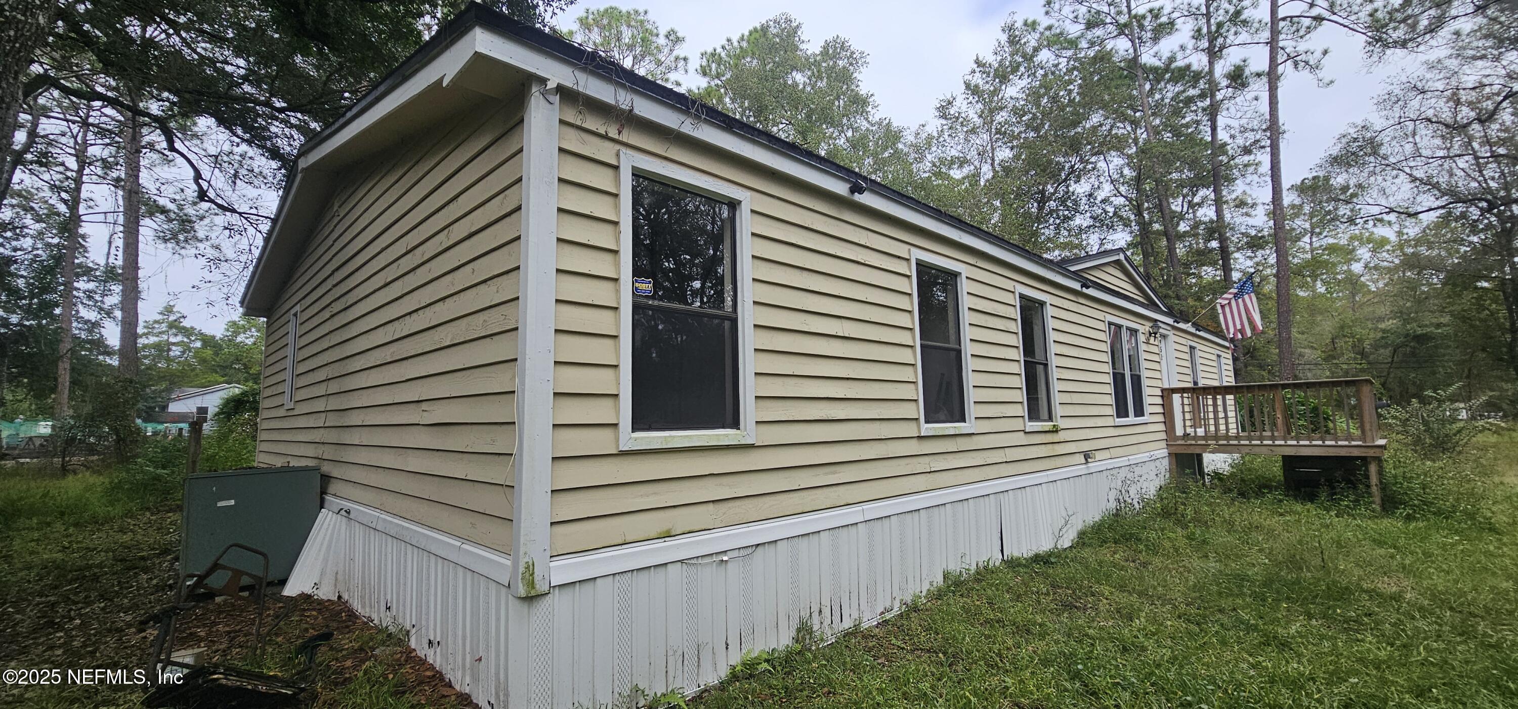 5951 Westwood Road North Jacksonville, FL 32234 - Photo 3 of 33 a view of a house with backyard and trees