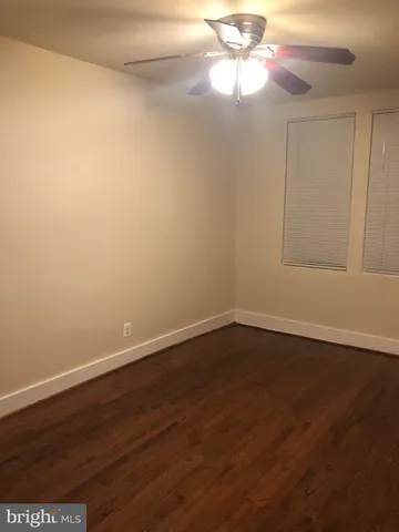 a bathroom with a sink and mirror with toilet