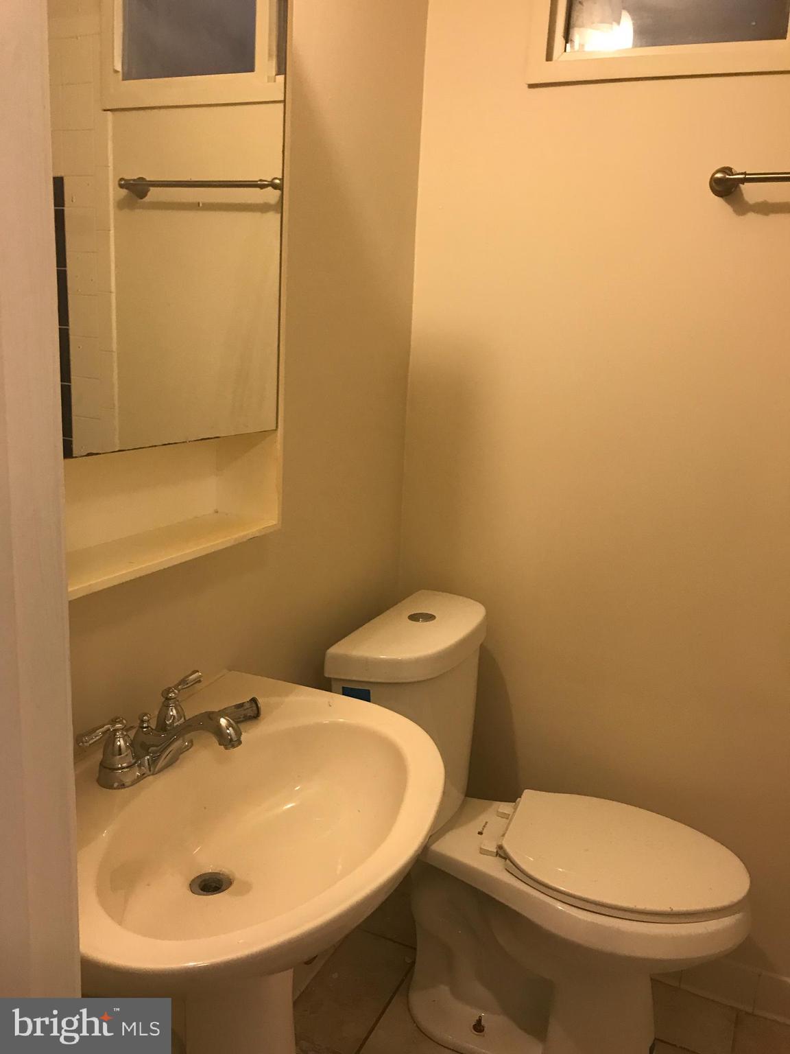 1918 I Street Northeast Washington, DC 20002 - Photo 16 of 29 a bathroom with a sink and mirror with toilet