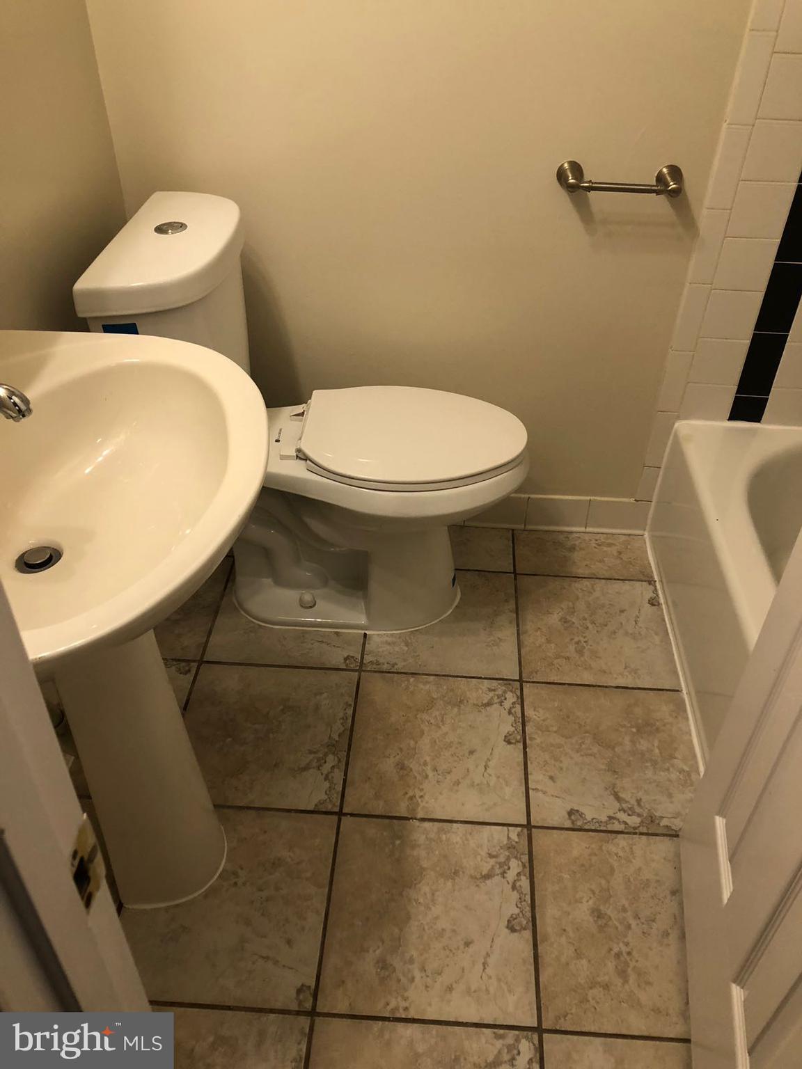 1918 I Street Northeast Washington, DC 20002 - Photo 18 of 29 a bathroom with a toilet and a sink