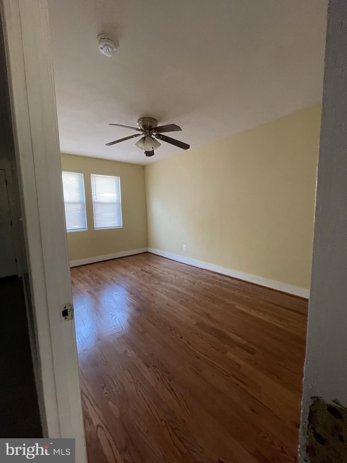 1918 I Street Northeast Washington, DC 20002 - Photo 22 of 29 an empty room with wooden floor and windows