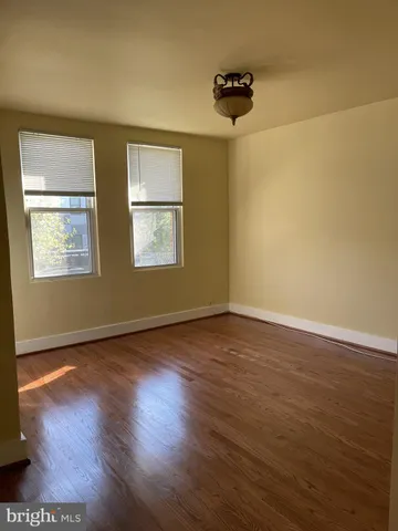 a view of livingroom with hardwood floor and window