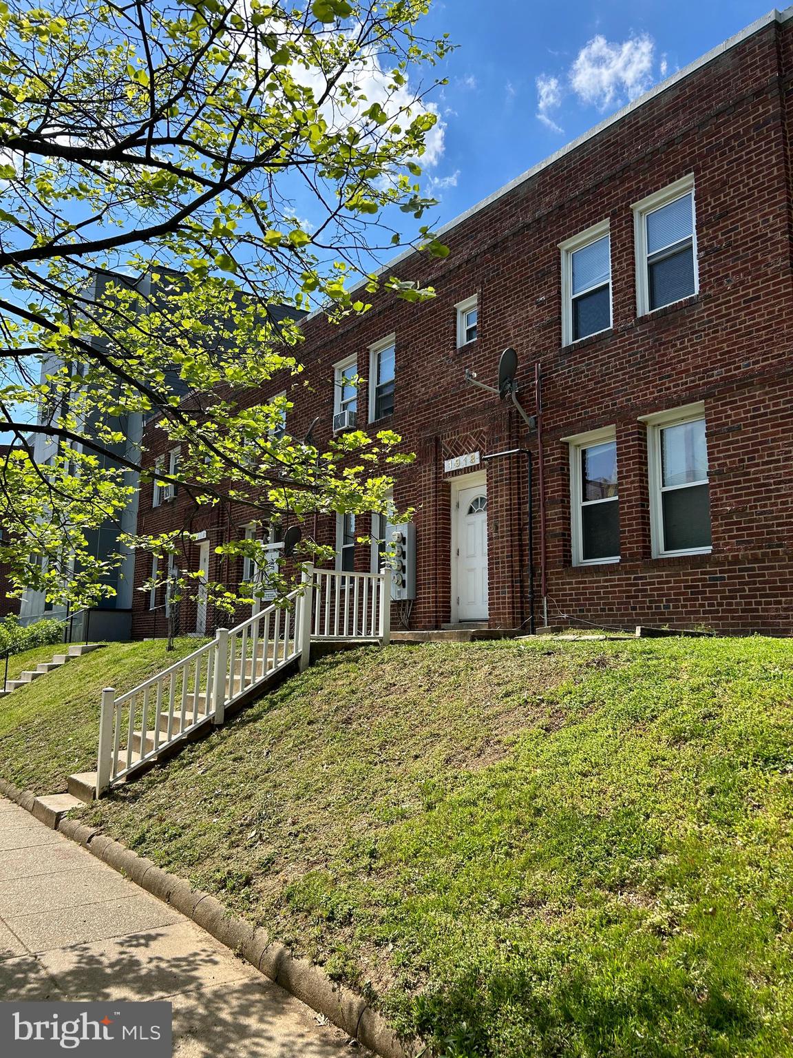1918 I Street Northeast Washington, DC 20002 - Photo 3 of 29 a front view of a house with a yard