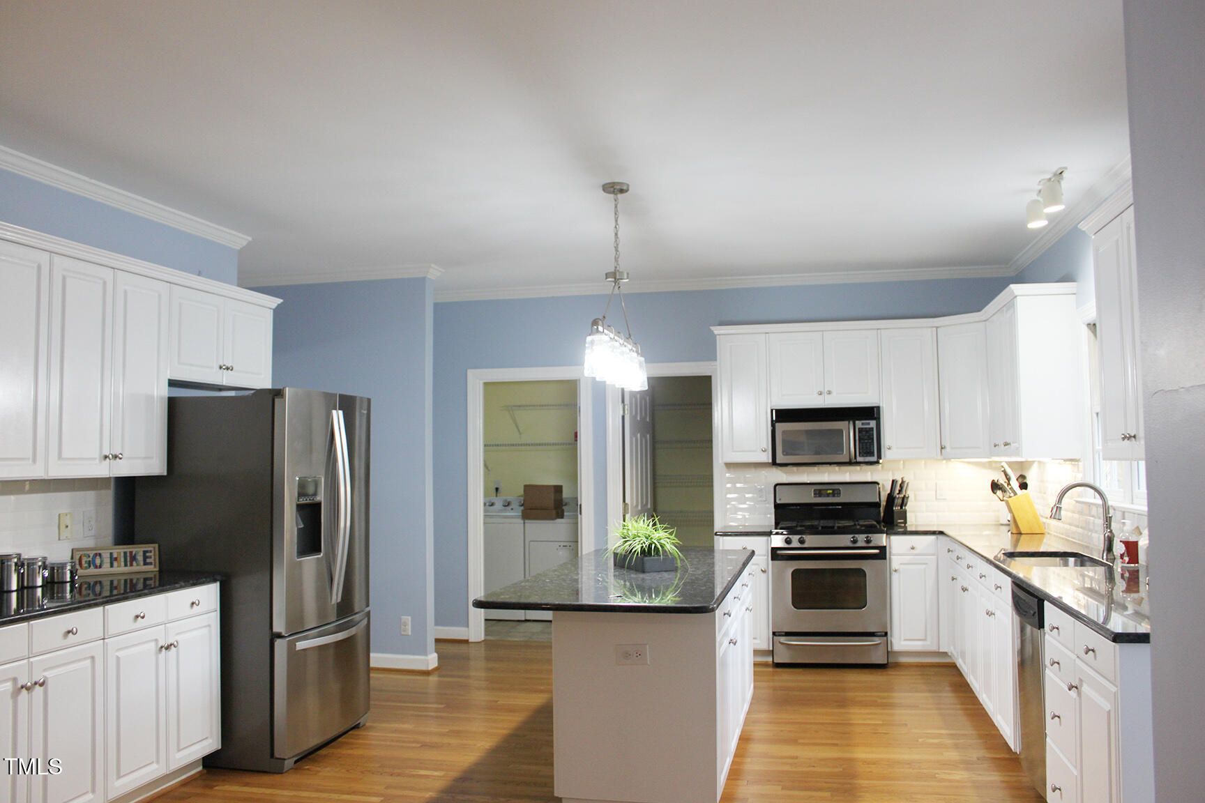 3100 Anderson Drive Raleigh, NC 27609 - Photo 12 of 31 a kitchen with stainless steel appliances a refrigerator sink and microwave