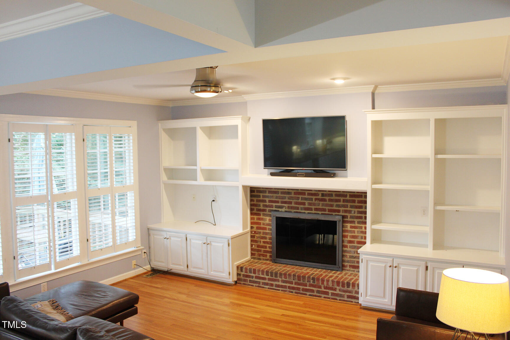 3100 Anderson Drive Raleigh, NC 27609 - Photo 13 of 31 a living room with furniture and a fireplace