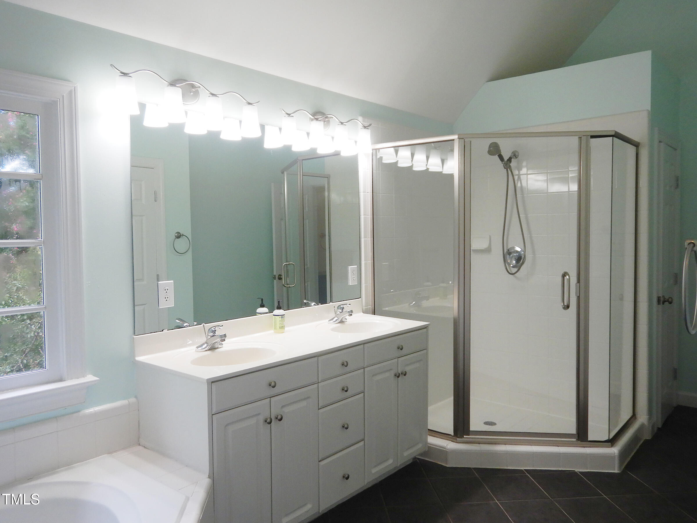 3100 Anderson Drive Raleigh, NC 27609 - Photo 20 of 31 a bathroom with a double vanity sink mirror and shower