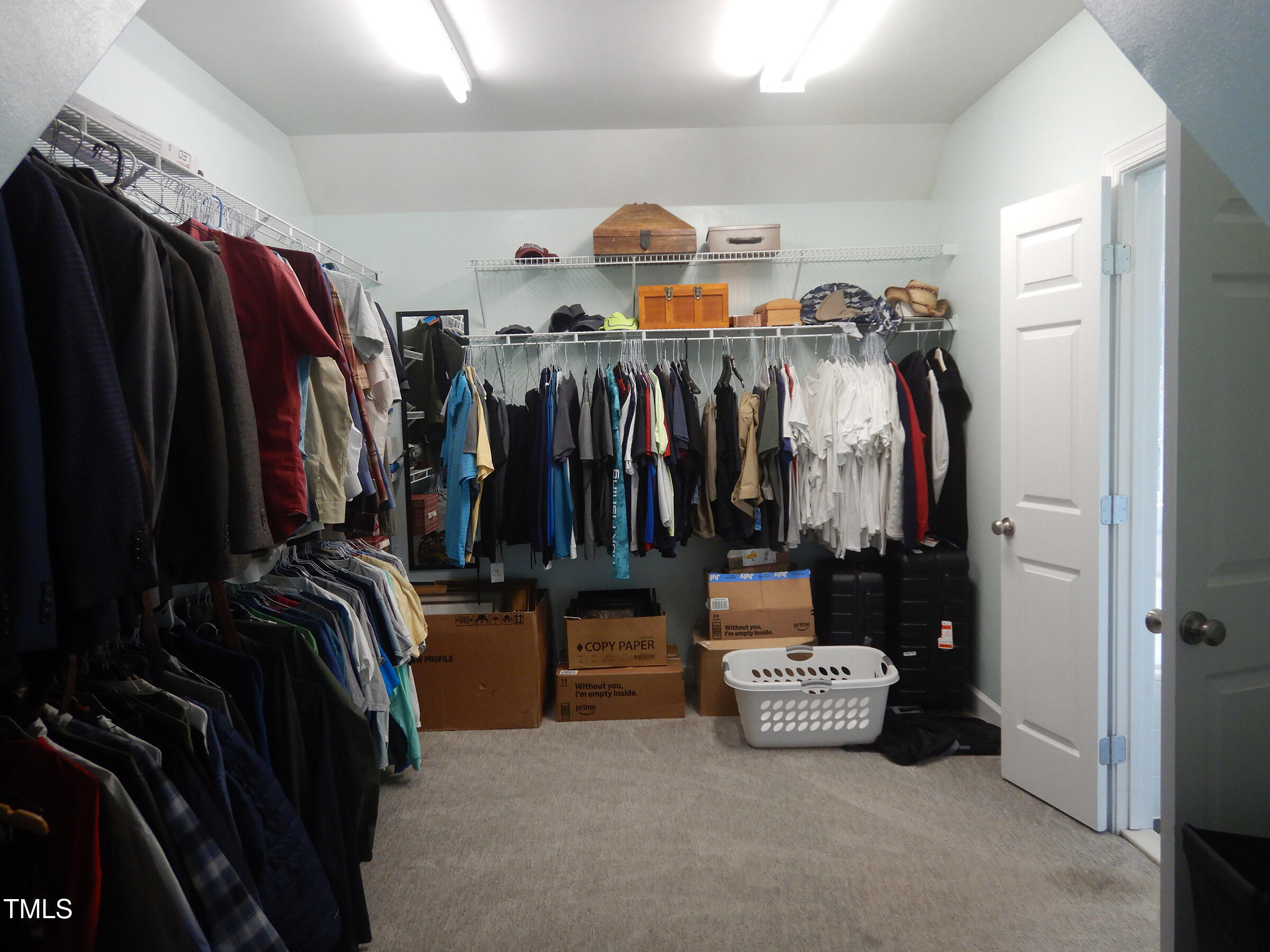 3100 Anderson Drive Raleigh, NC 27609 - Photo 21 of 31 a view of walk in closet with clothes and shoes