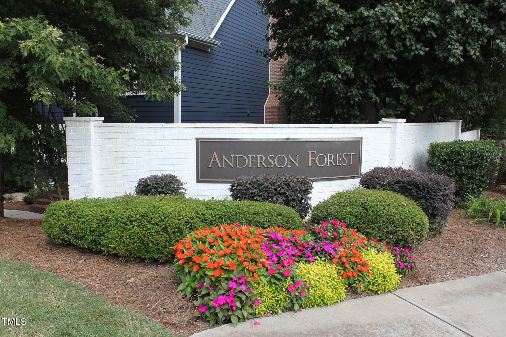 3100 Anderson Drive Raleigh, NC 27609 - Photo 31 of 31 a sign that is in front of flowers