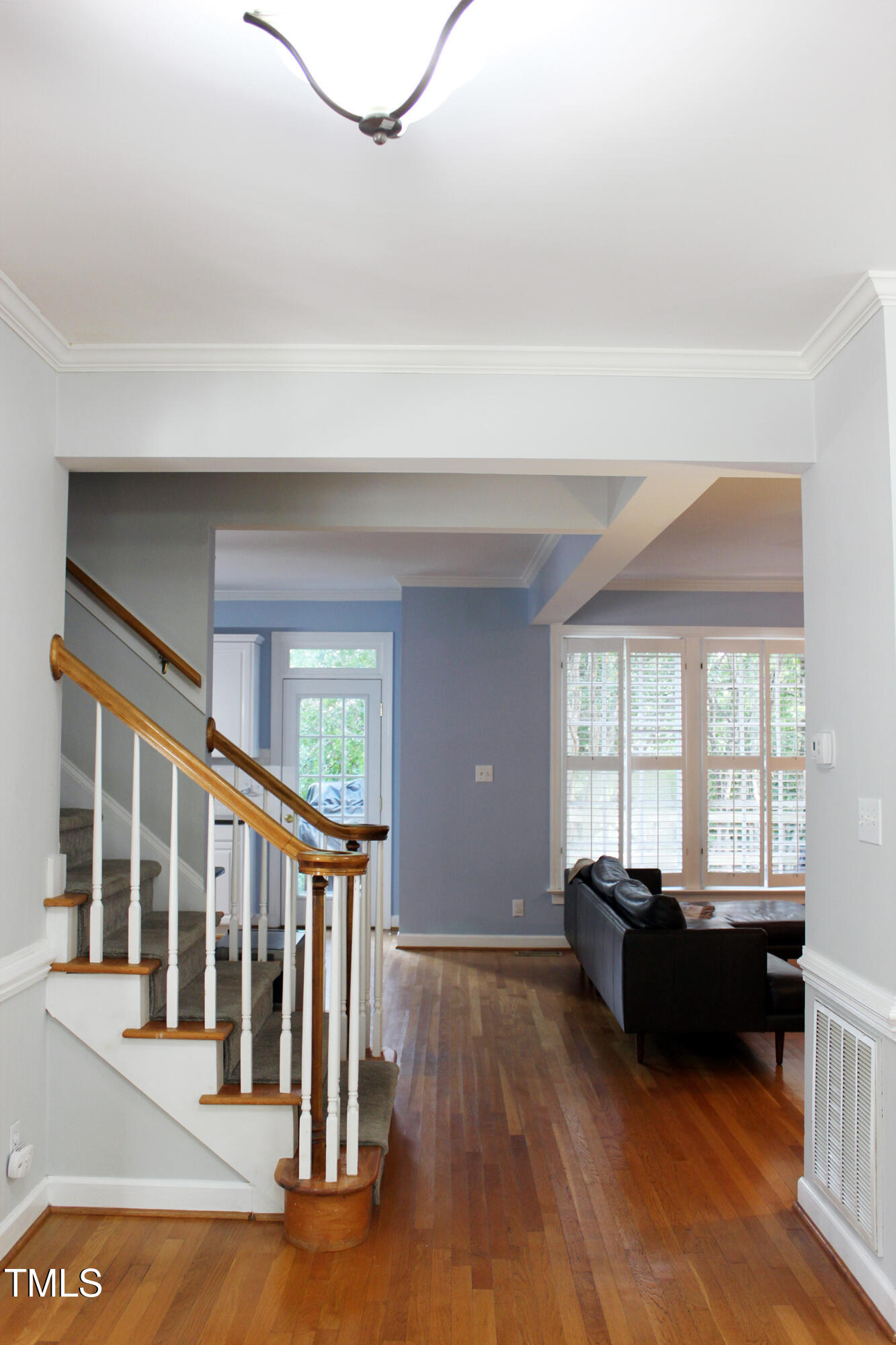 3100 Anderson Drive Raleigh, NC 27609 - Photo 4 of 31 a living room with furniture and a large window