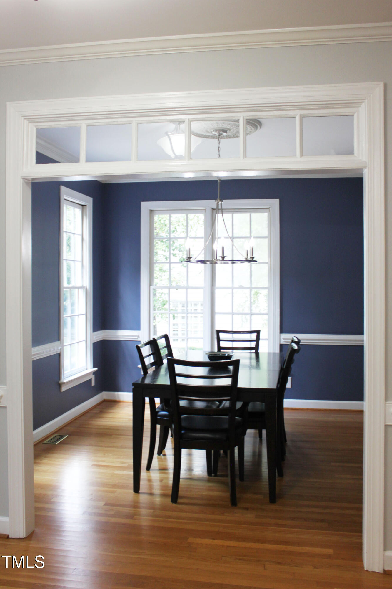 3100 Anderson Drive Raleigh, NC 27609 - Photo 5 of 31 a view of a dining room with furniture and wooden floor
