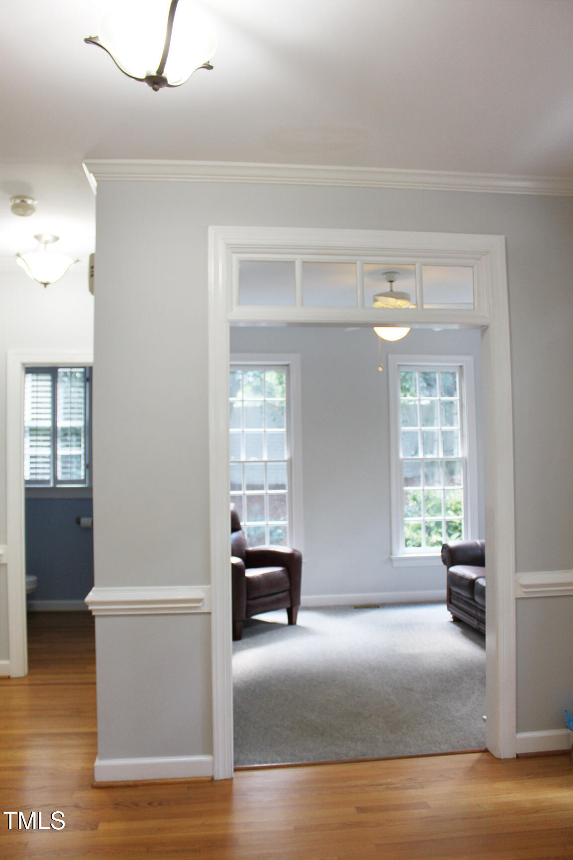 3100 Anderson Drive Raleigh, NC 27609 - Photo 8 of 31 a view of an empty room with window and wooden floor