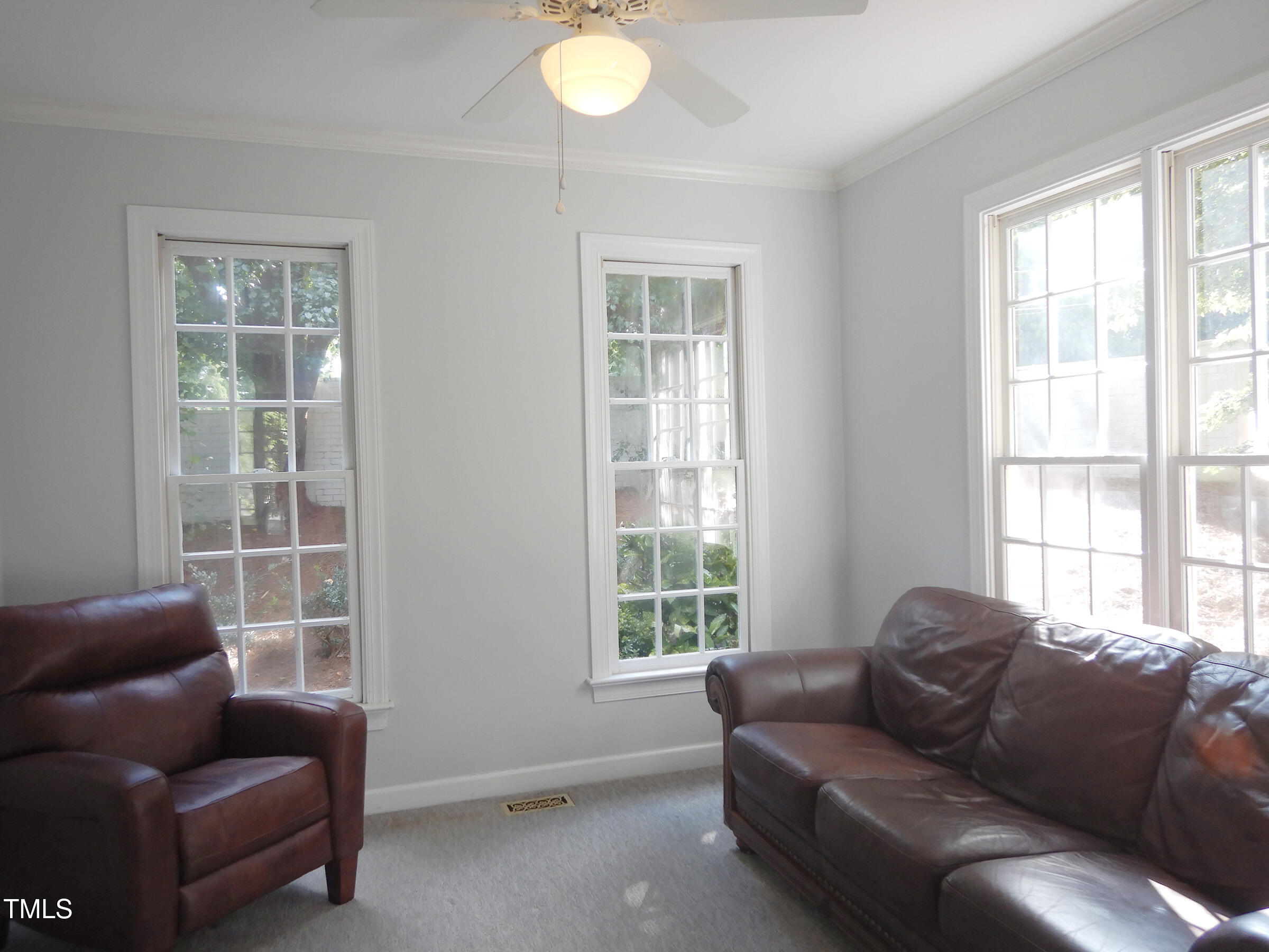 3100 Anderson Drive Raleigh, NC 27609 - Photo 9 of 31 a living room with furniture and a window