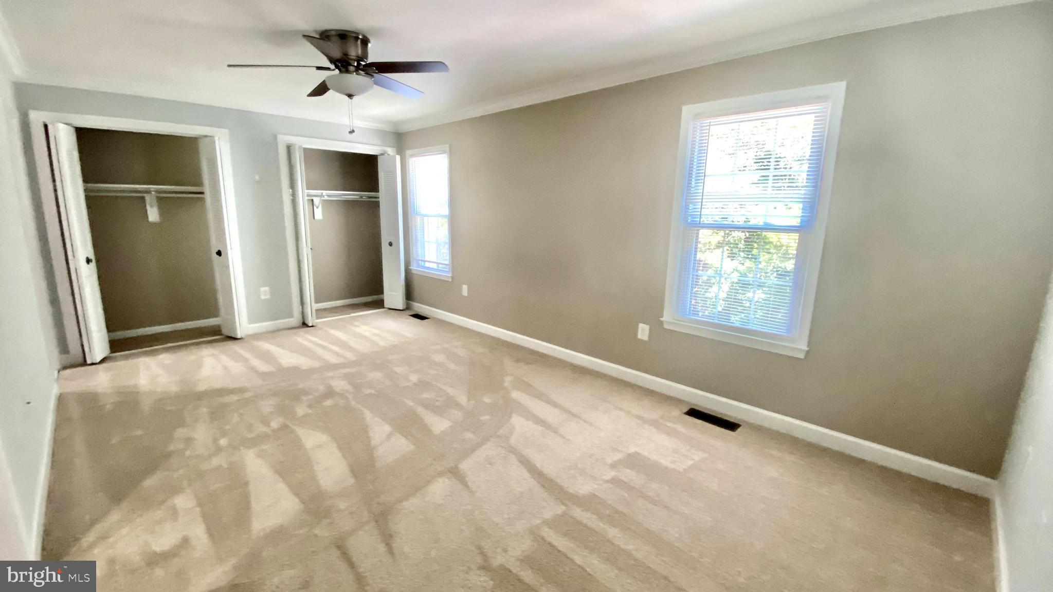 7419 Spring Tree Drive Springfield, VA 22153 - Photo 12 of 22 Main bedroom with large closet and ceiling fan