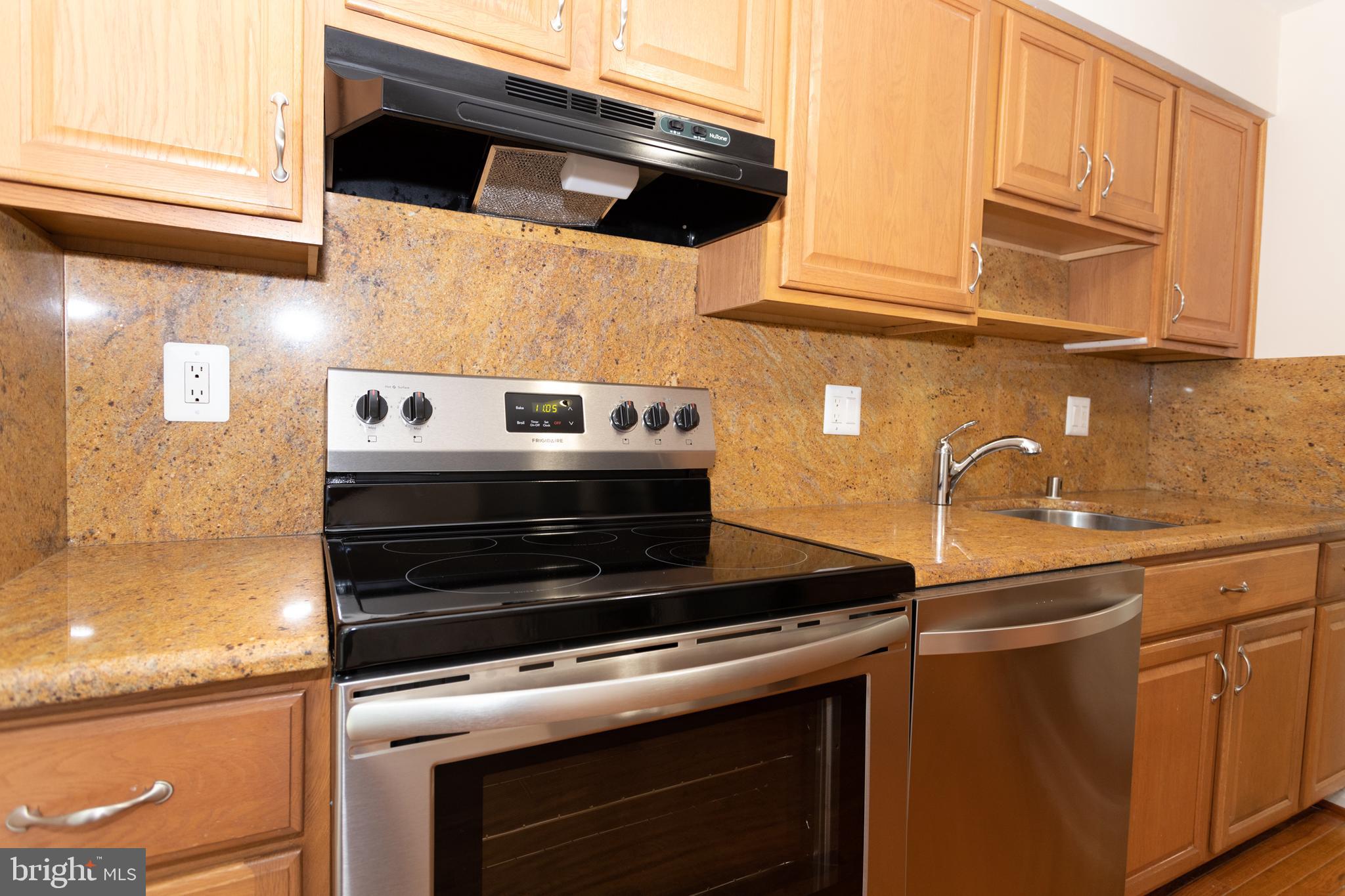 7419 Spring Tree Drive Springfield, VA 22153 - Photo 8 of 22 Granite countertops and backsplash