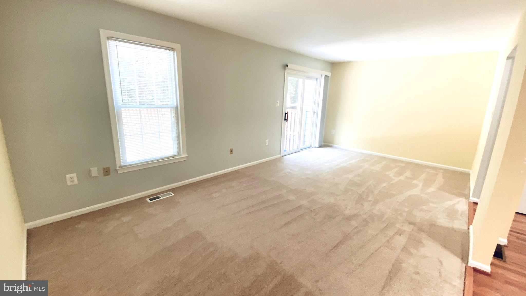 7419 Spring Tree Drive Springfield, VA 22153 - Photo 10 of 22 Living room with a sliding glass door