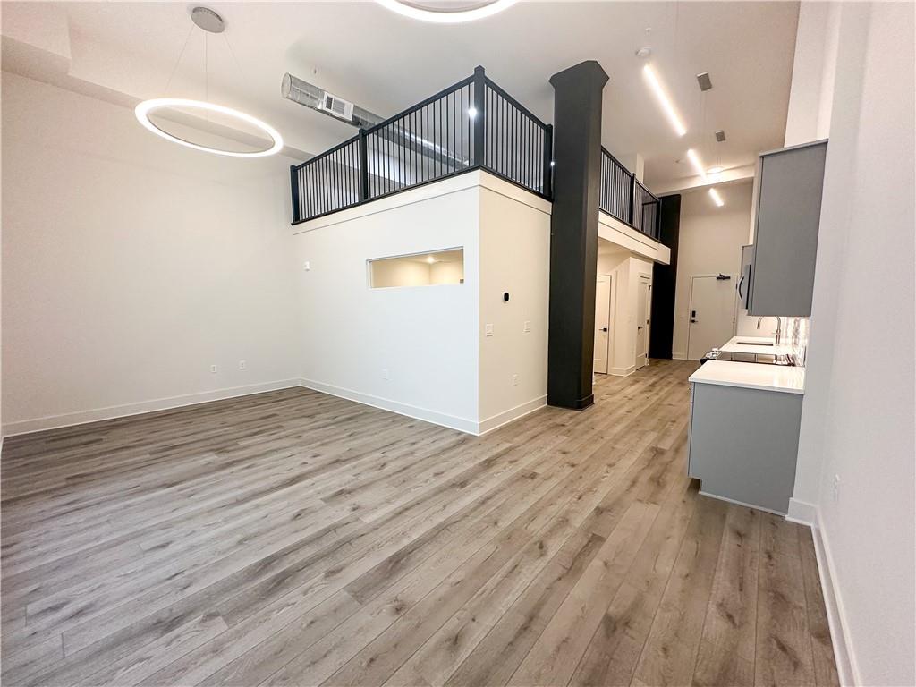 108 Park Place, Unit 210 Decatur, GA 30030 - Photo 1 of 1 a view of a hallway with wooden floor