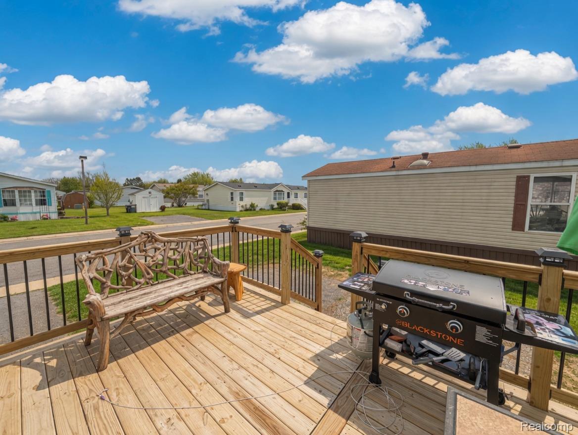6988 McKean Road Ypsilanti, MI 48197 - Photo 27 of 31 Deck with a residential view and area for grilling