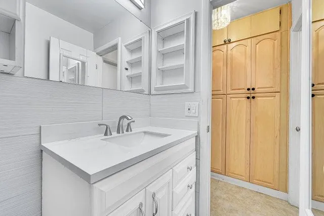 a bathroom with a sink and a mirror
