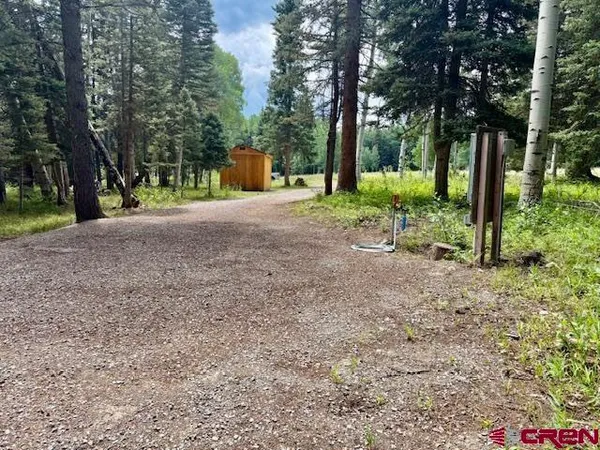 a view of outdoor space with playground and green space