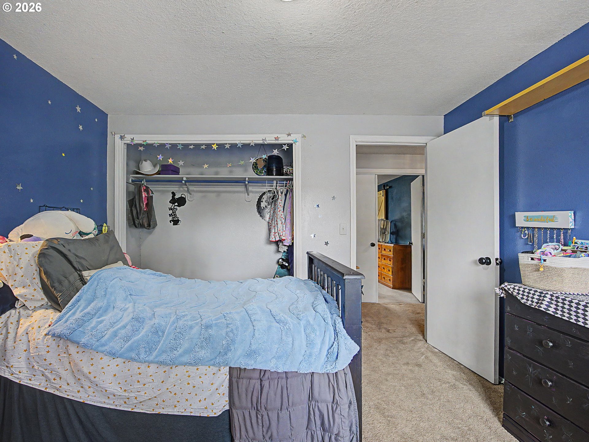 18015 Davis Street Sandy, OR 97055 - Photo 21 of 40 a bedroom with a bed and wooden floor