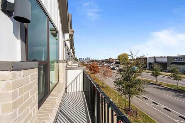 a view of a balcony with wooden floor and stairs