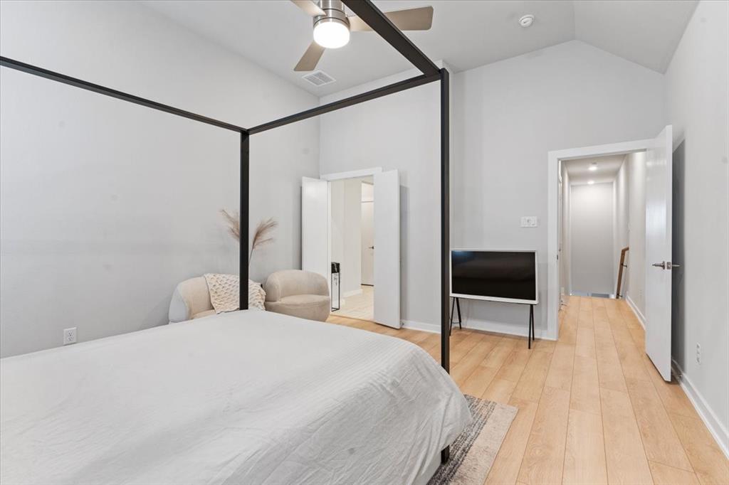 2268 Rook Drive Dallas, TX 75211 - Photo 17 of 19 a bedroom with a bed and a flat screen tv