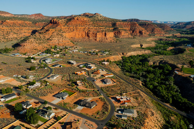 50 Dry Gulch Road, Unit 50 Kanab, UT 84741 - Photo 16 of 20 Desert landscape with established residential properties, winding roads, and natural rock formations