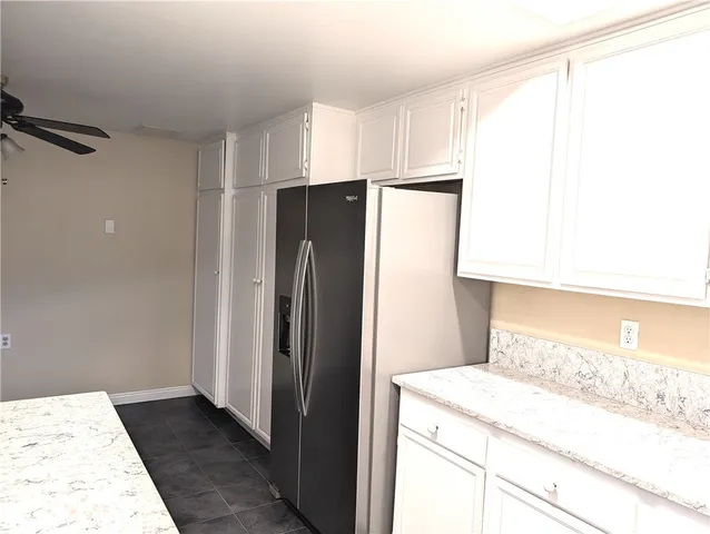 a kitchen with a refrigerator and countertop