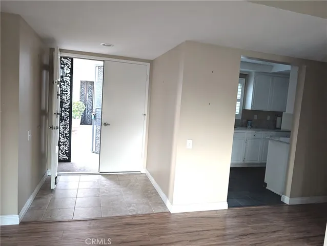 a view of entryway with wooden floor