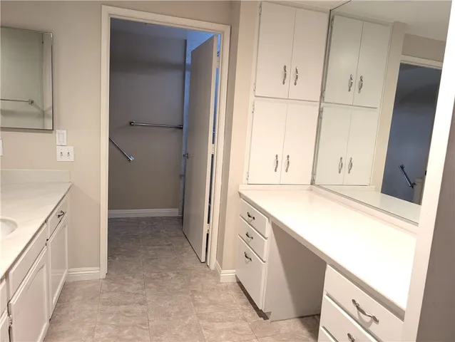 a white toilet sitting next to a shower