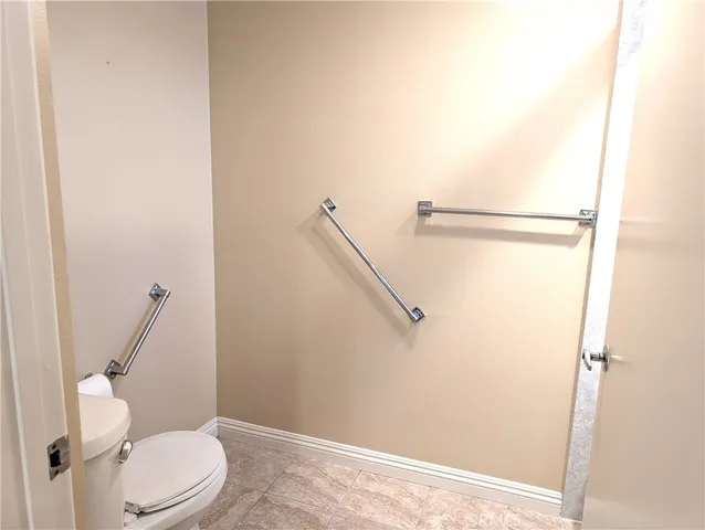 a bathroom with a glass shower door