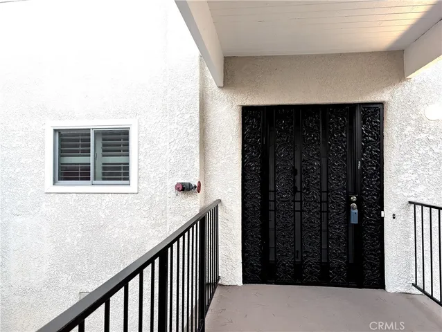 a view of balcony with furniture