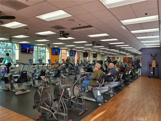 a view of a swimming pool with outdoor seating