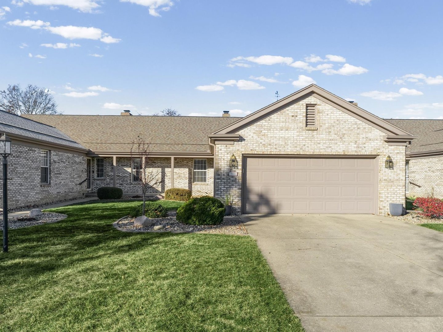 1901 Lakeside Drive, Unit B Champaign, IL 61821 - Photo 1 of 26 a front view of a house with garden