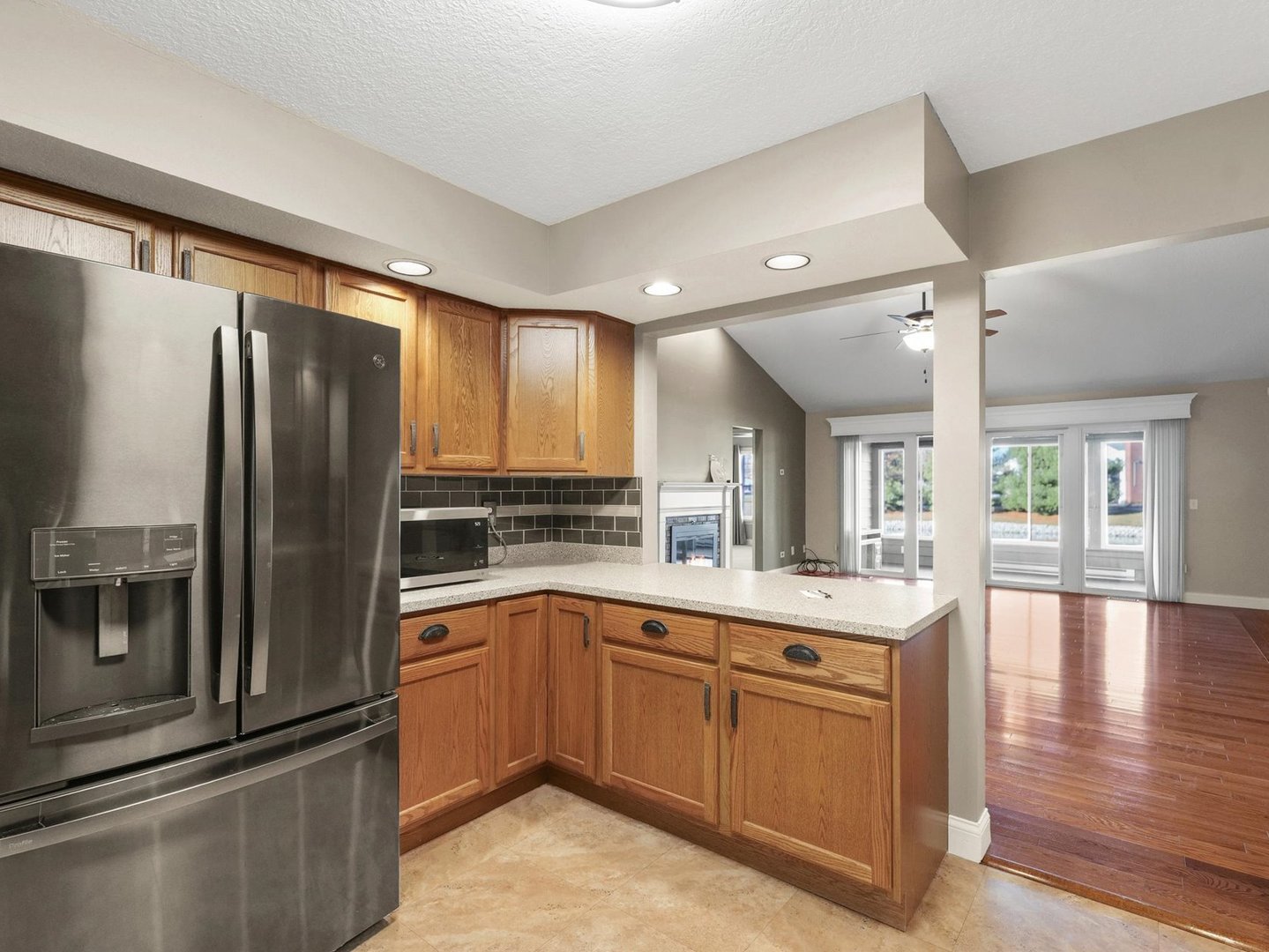1901 Lakeside Drive, Unit B Champaign, IL 61821 - Photo 11 of 26 a kitchen with a sink stainless steel appliances and cabinets